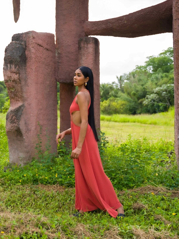 Side profile of sexy sundress with waist cutouts and halter neckline