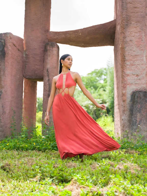 Model wearing sexy burnt orange sundress on summer vacation