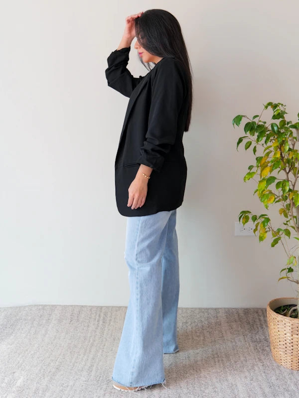Side view of our ladies long black blazer. 