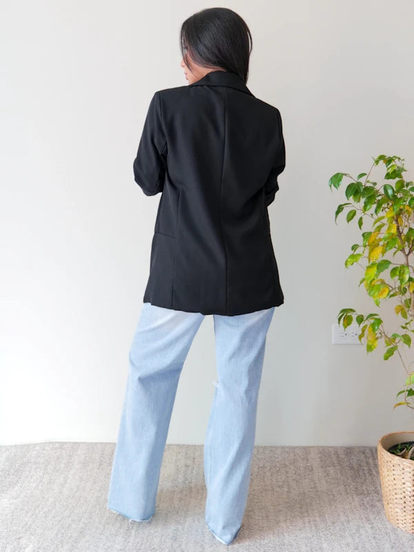 Back view of our black work blazer for women. 
