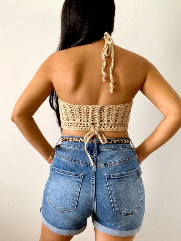 Back view of the cuffed blue jeans. 