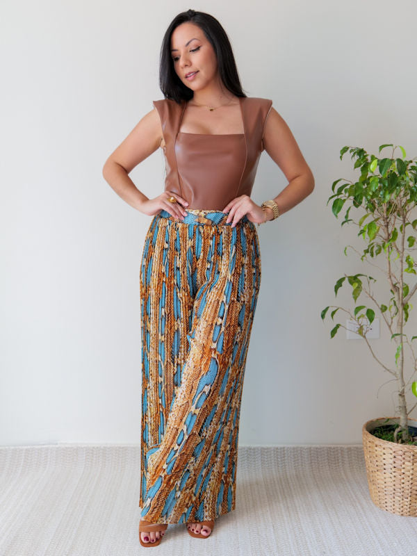 Woman showing an outfit of a dressy bodysuit and wide leg pants.