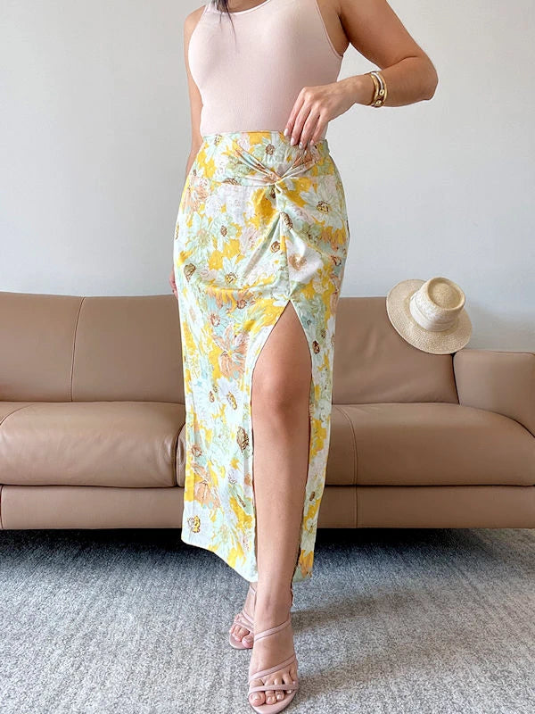 Image showing a floral skirt with slit in yellow color. 