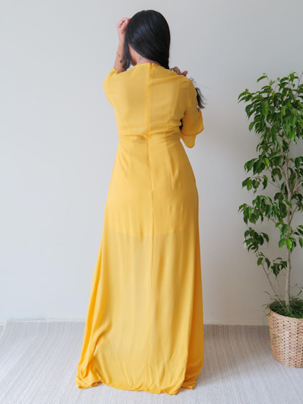 Mustard maxi dress with 3/4 ruffled sleeves and front slit on skirt