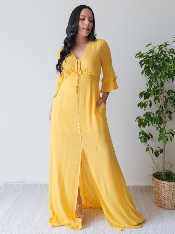 Mustard maxi dress with 3/4 ruffled sleeves and front slit on skirt