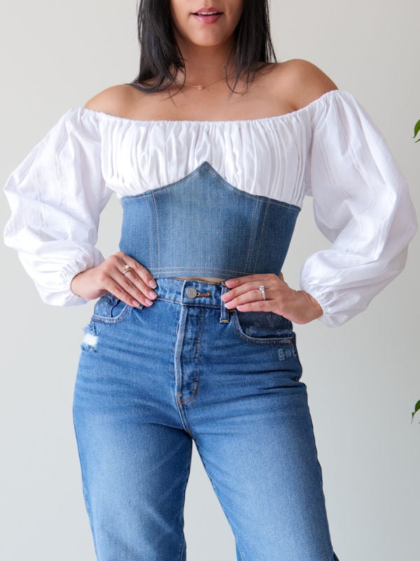 Off shoulders peasant corset top made with top half in white eyelet cotton and bottom half in washed denim