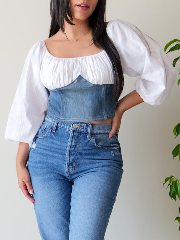Off shoulders peasant corset top made with top half in white eyelet cotton and bottom half in washed denim