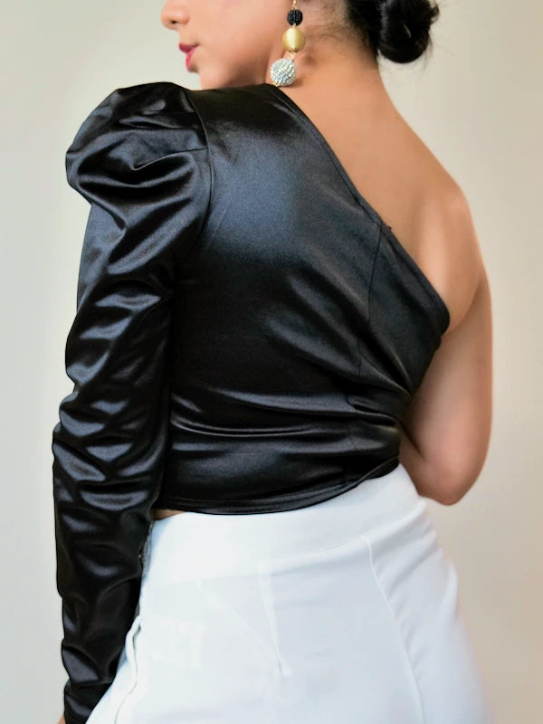 Image of our one shoulder puff sleeve top in black. 